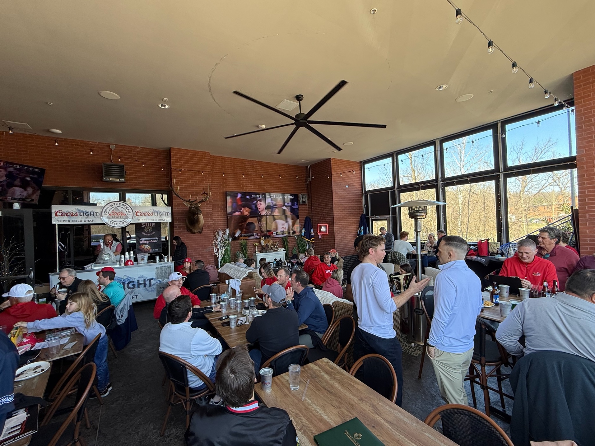 The Clubhouse dining room with a packed group on game day